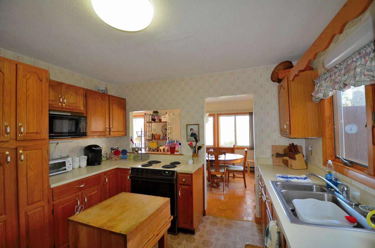 202 Kibbe Road Otis, MA 01029 - Photo 11 of 22 a kitchen with a sink stove top oven and microwave
