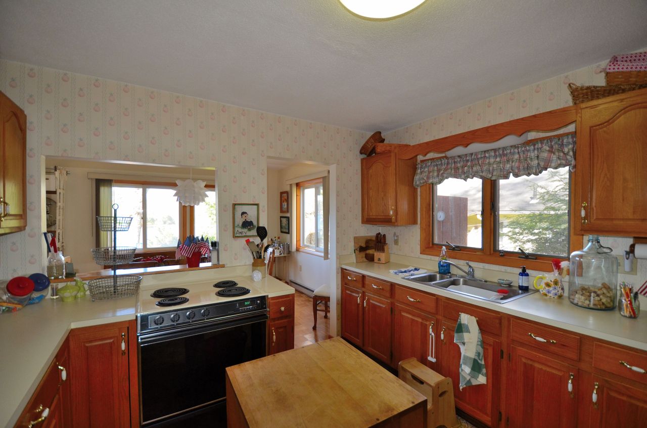 202 Kibbe Road Otis, MA 01029 - Photo 12 of 22 a kitchen with a stove a sink and a refrigerator