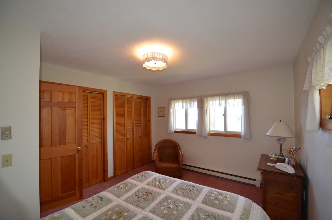 202 Kibbe Road Otis, MA 01029 - Photo 20 of 22 a bedroom with a bed and a window