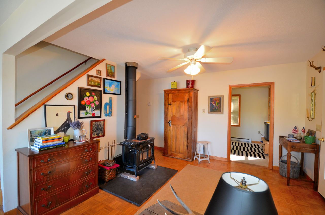 202 Kibbe Road Otis, MA 01029 - Photo 8 of 22 a room with furniture and a chandelier