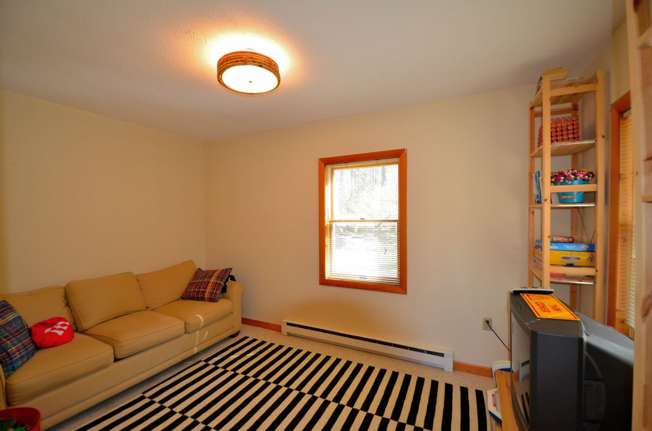 202 Kibbe Road Otis, MA 01029 - Photo 10 of 22 a living room with furniture and a window