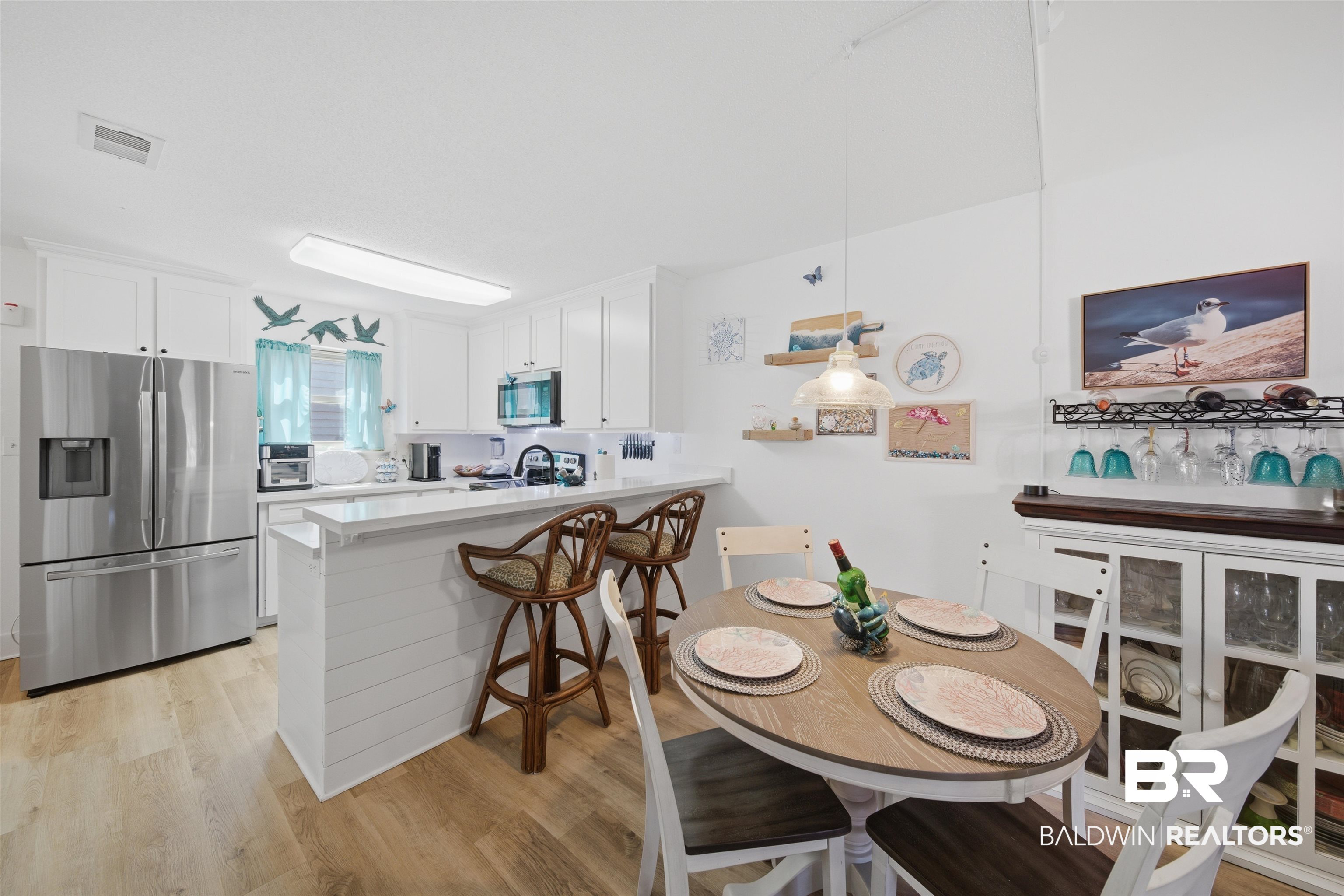389 Clubhouse Drive, Unit 5H Gulf Shores, AL 36542 - Photo 7 of 43 dining to kitchen