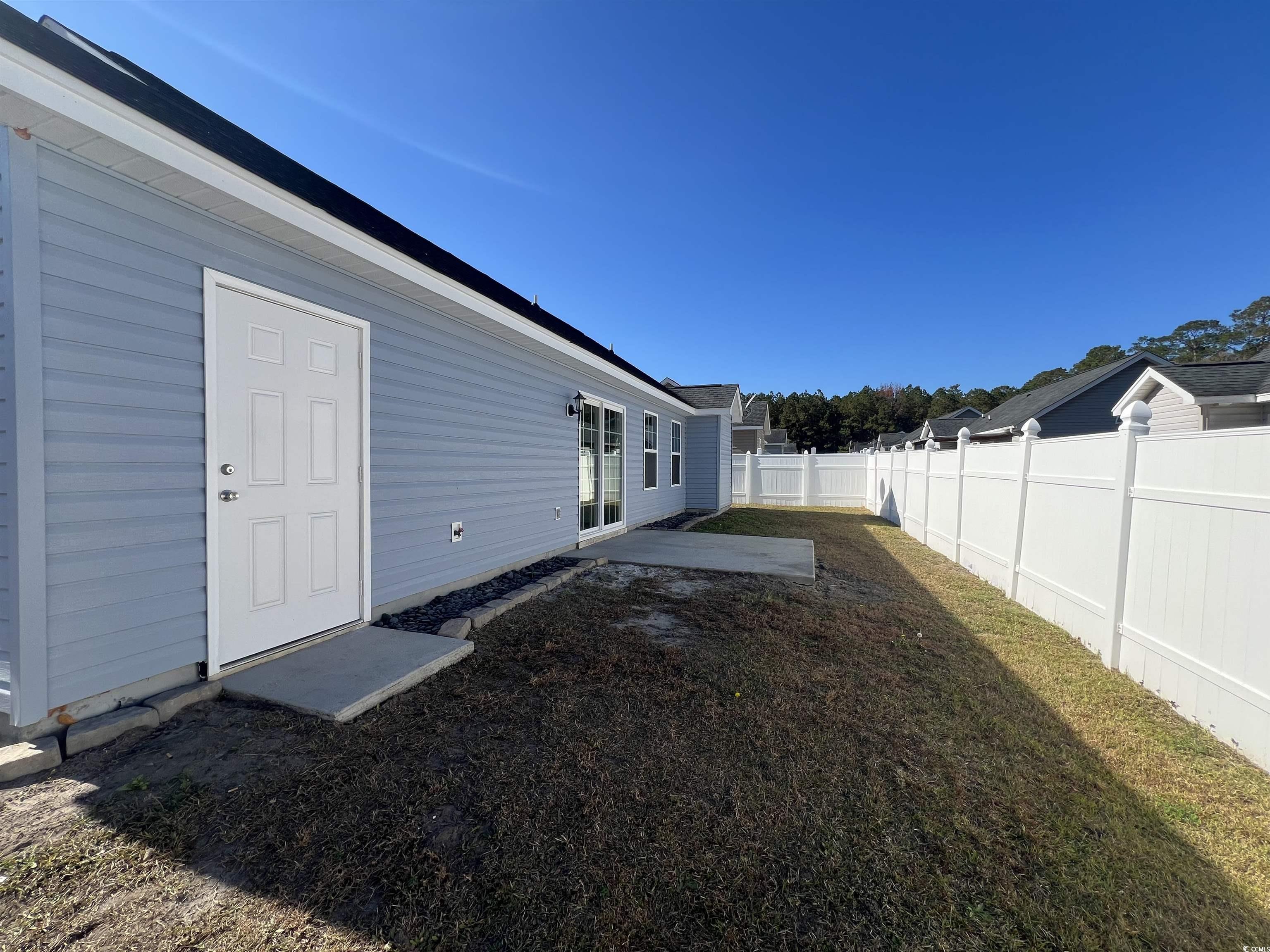 225 Upper Saddle Circle Conway, SC 29526 - Photo 18 of 24 Fenced backyard with a patio