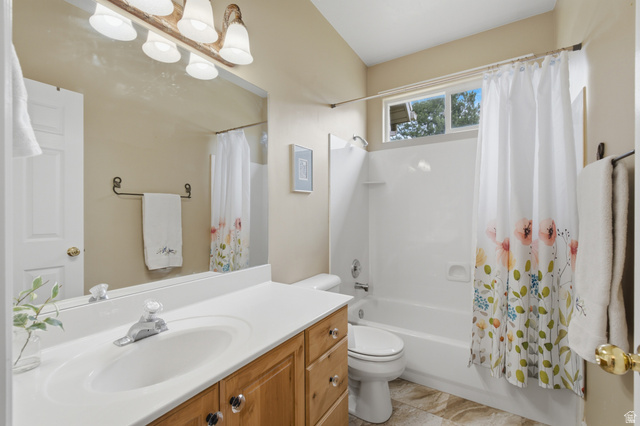 11811 Cottage View Lane Draper, UT 84020 - Photo 17 of 25 Full bathroom featuring a single vanity with wood cabinetry, a white countertop, and an integrated sink