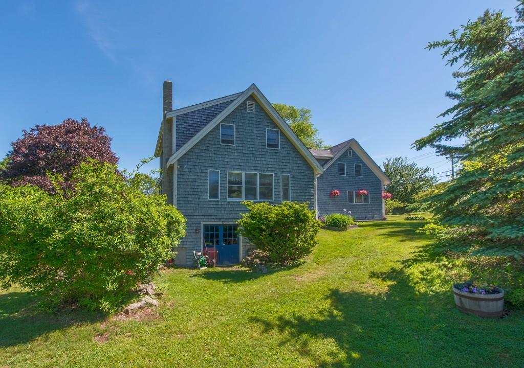 581 Ocean Point Road Boothbay, ME 04544 - Photo 3 of 25 Side view shows walk-out basement