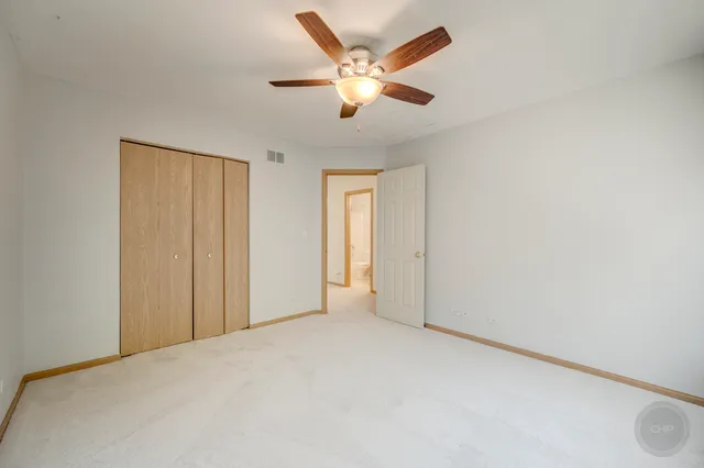 a view of an empty room and cabinet