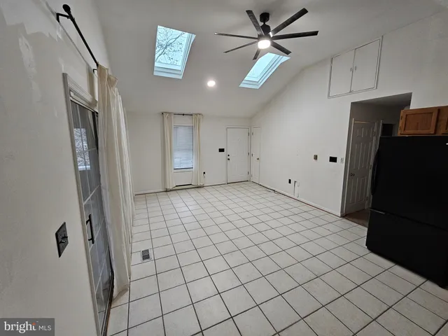 a kitchen with stainless steel appliances a refrigerator and a sink