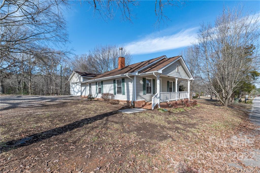 872 State Rd S-29-376 Lancaster, SC 29720 - Photo 4 of 15 a front view of house with yard outdoor seating and barbeque oven
