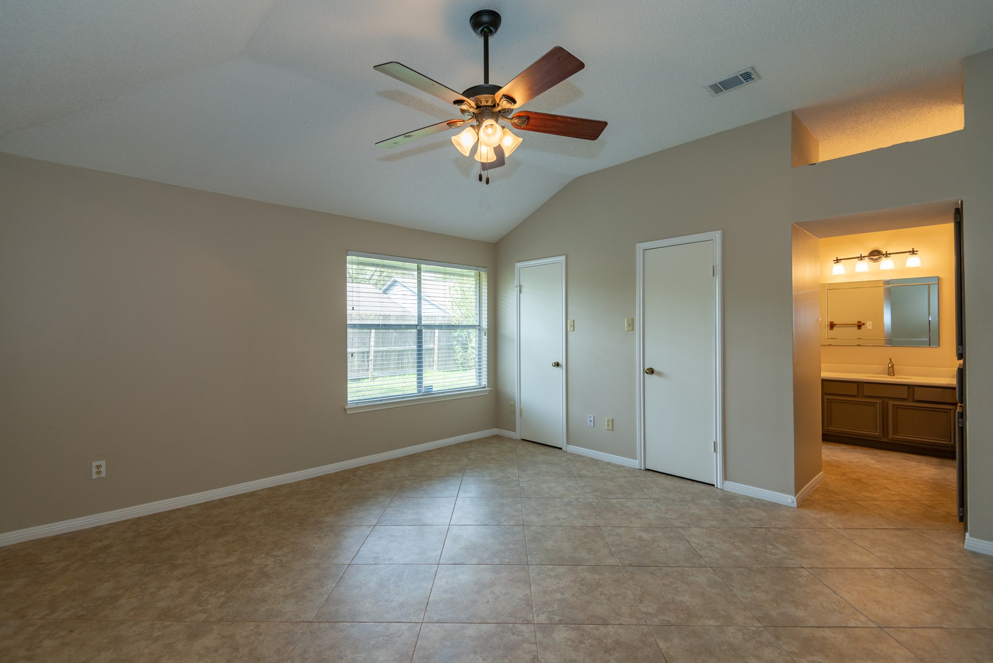 12034 Paddock Way Houston, TX 77065 - Photo 11 of 19 High ceilings in the primary bedroom.