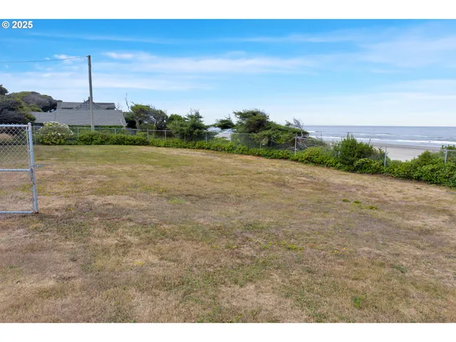a view of a field with an ocean