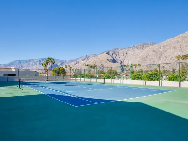 a view of an outdoor space and tennis court
