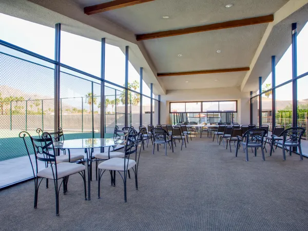 a room with lots of tables and chairs