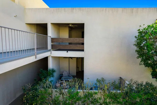 a view of a house with a small yard