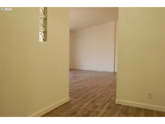a view of a bathroom with a sink and a mirror