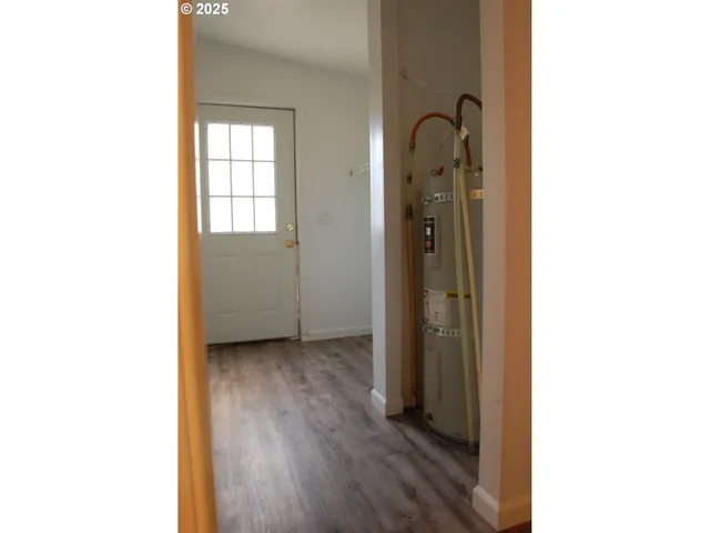 a view of a bathroom from a hallway