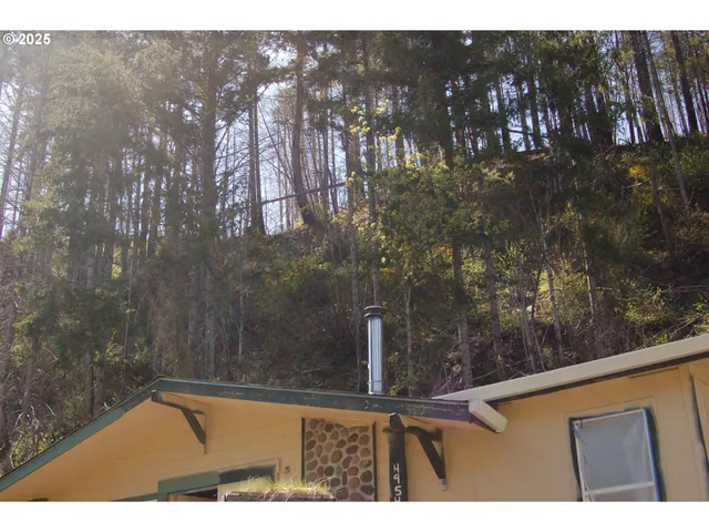 a bathroom with a sink and a chair