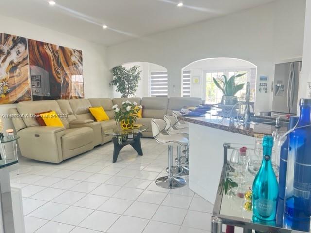 9435 Southwest 156th Place, Unit 9435 Miami, FL 33196 - Photo 15 of 28 a living room with furniture and wooden floor