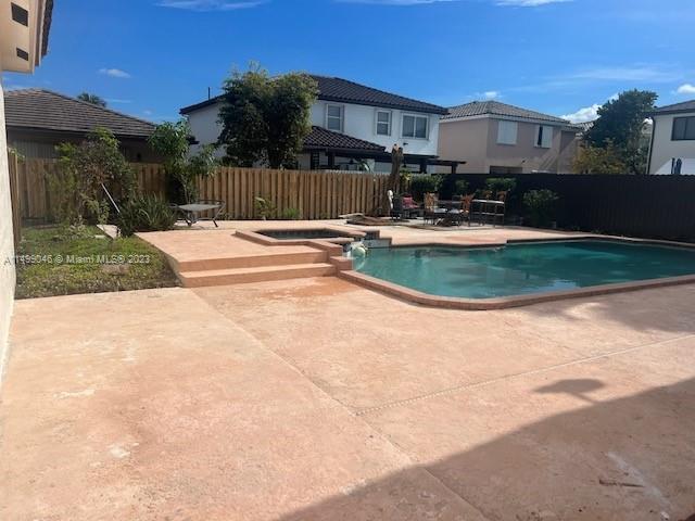 9435 Southwest 156th Place, Unit 9435 Miami, FL 33196 - Photo 27 of 28 a view of a house with a yard