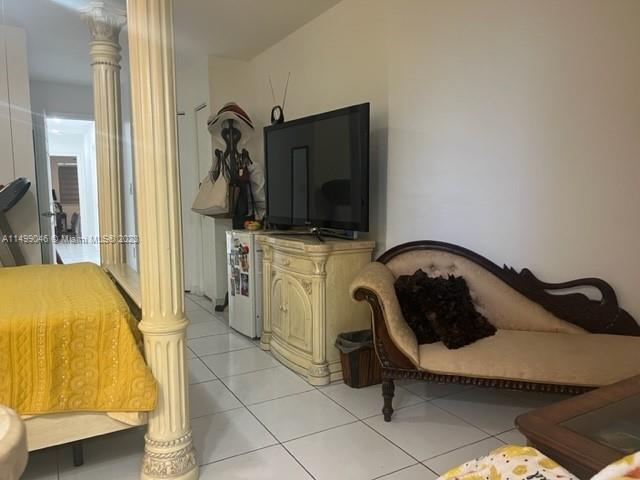 9435 Southwest 156th Place, Unit 9435 Miami, FL 33196 - Photo 7 of 28 a bedroom with a bed and a flat screen tv