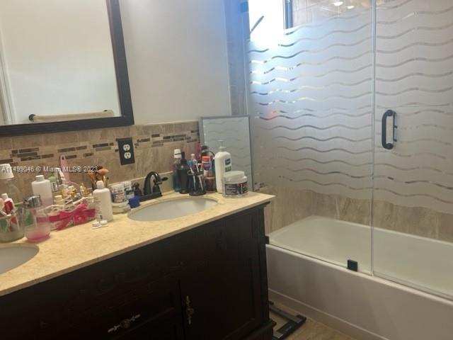 9435 Southwest 156th Place, Unit 9435 Miami, FL 33196 - Photo 9 of 28 a bathroom with a sink vanity tub and shower
