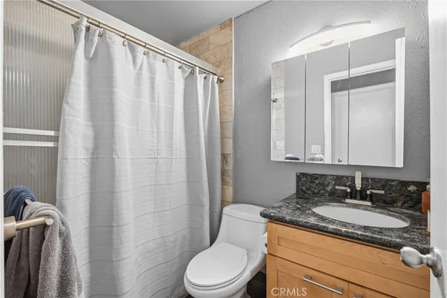 a room with furniture and a flat screen tv