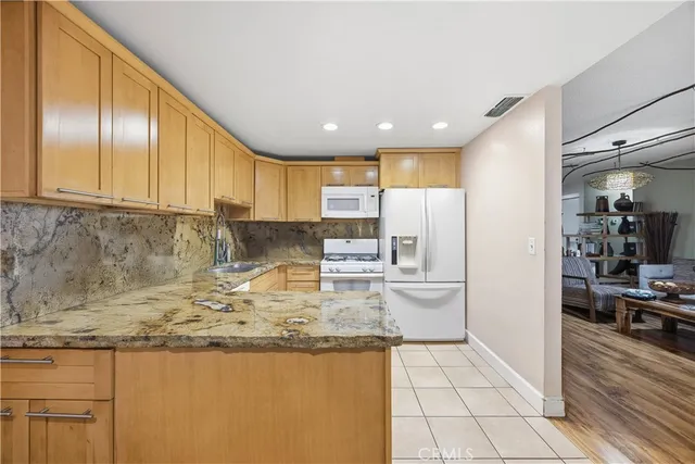 a living room with hard wood flooring and a window