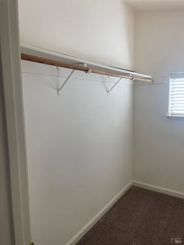 a view of a room with racks on the wall