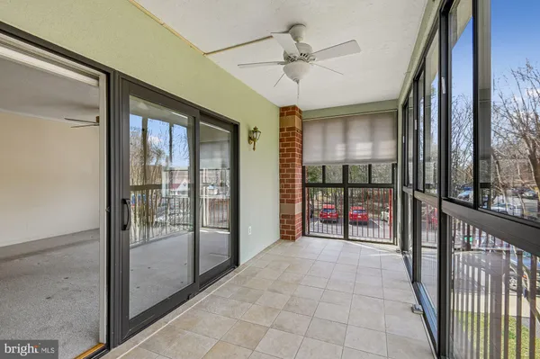 a view of a hallway with a glass door