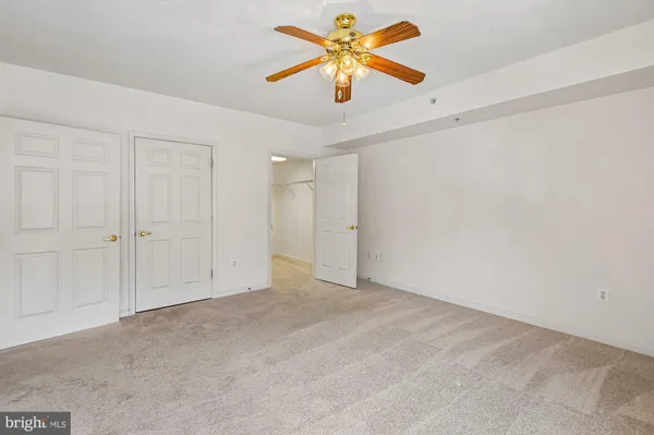 a view of a ceiling fan in a room