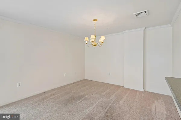 a view of a chandelier in big room