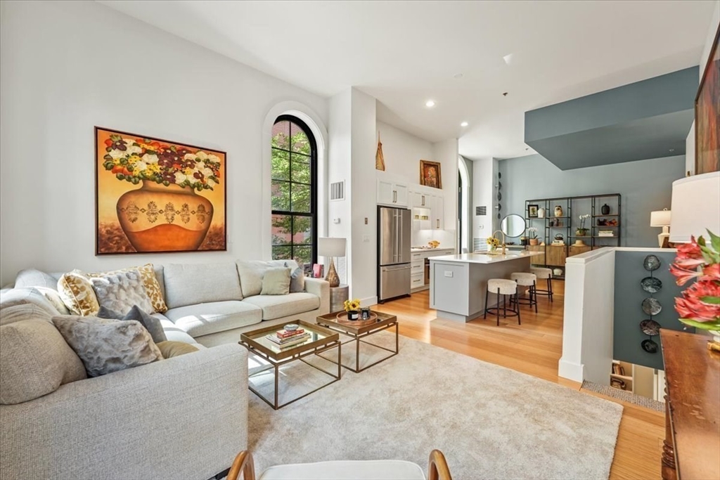 21 Father Francis Gilday Street, Unit 114 Boston, MA 02118 - Photo 11 of 28 a living room with furniture and a table