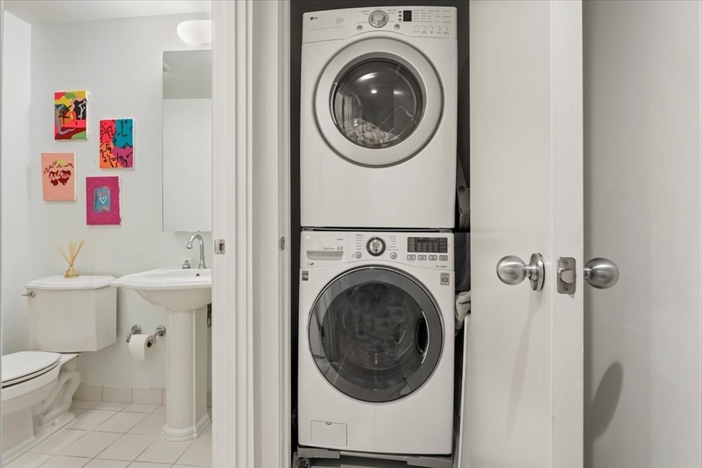 21 Father Francis Gilday Street, Unit 114 Boston, MA 02118 - Photo 17 of 28 a utility room with dryer and washer