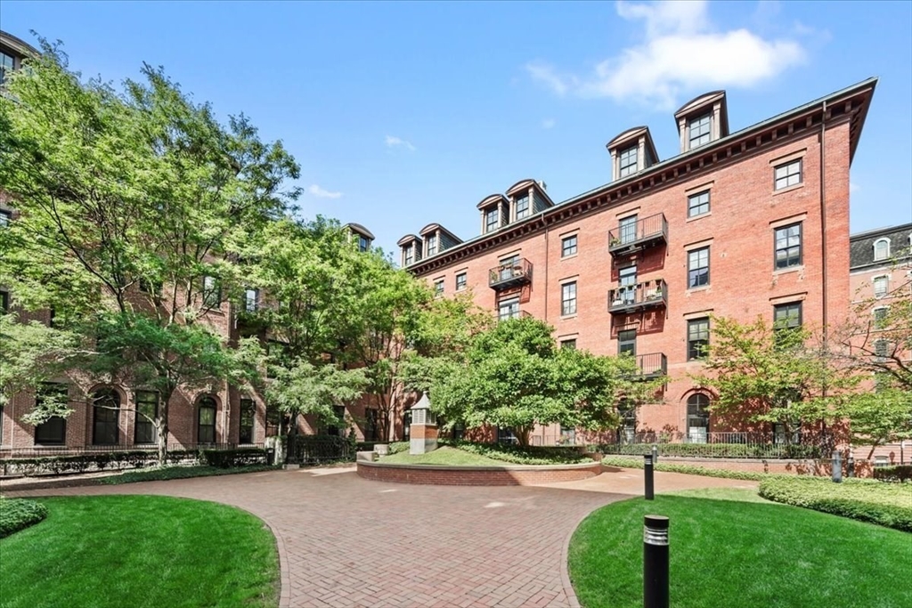 21 Father Francis Gilday Street, Unit 114 Boston, MA 02118 - Photo 26 of 28 front view of a building with a yard