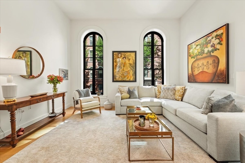 21 Father Francis Gilday Street, Unit 114 Boston, MA 02118 - Photo 7 of 28 a living room with furniture and a large window