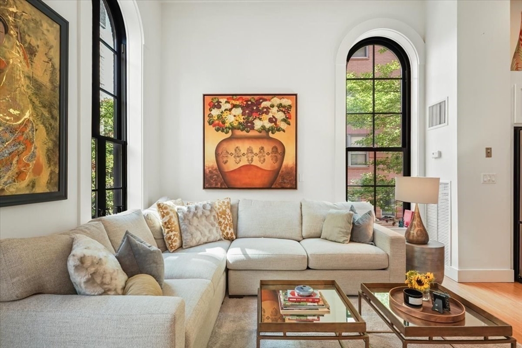 21 Father Francis Gilday Street, Unit 114 Boston, MA 02118 - Photo 9 of 28 a living room with furniture and a window