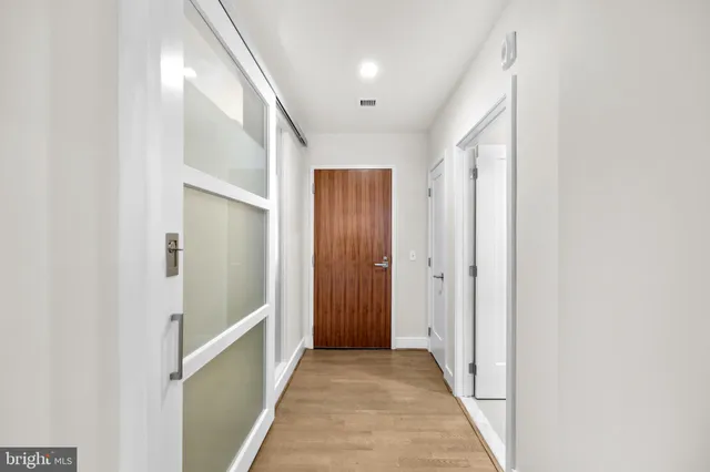 a bedroom with a bed and a lamp