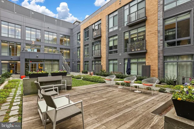 a front view of a building with parking