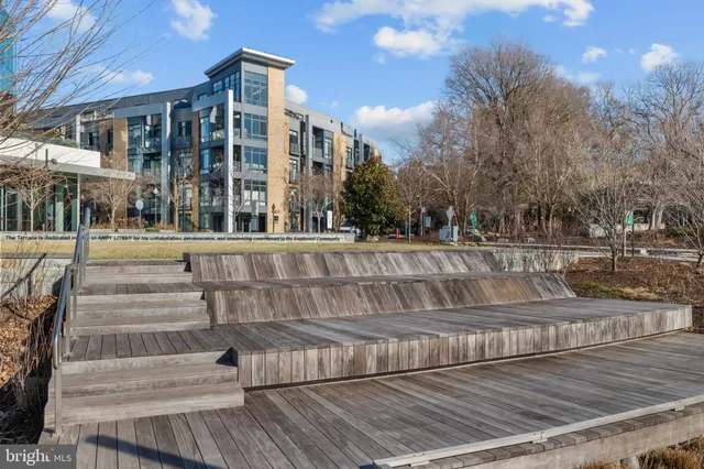 a view of a balcony with wooden floor