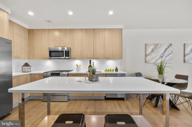 a kitchen with a table chairs and a stove