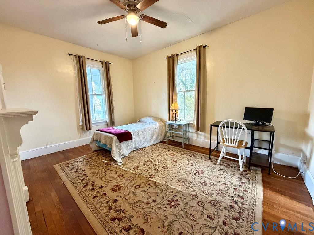 224 Courthouse Road Heathsville, VA 22473 - Photo 17 of 37 a bedroom with a bed and wooden floor