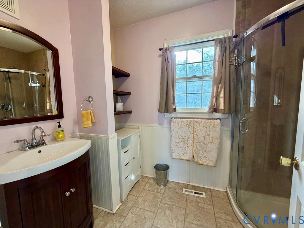 224 Courthouse Road Heathsville, VA 22473 - Photo 19 of 37 a bathroom with a sink and a mirror
