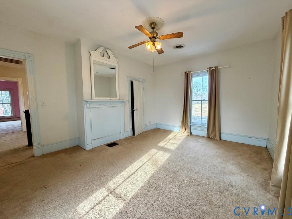 224 Courthouse Road Heathsville, VA 22473 - Photo 22 of 37 a view of a livingroom with a ceiling fan and window