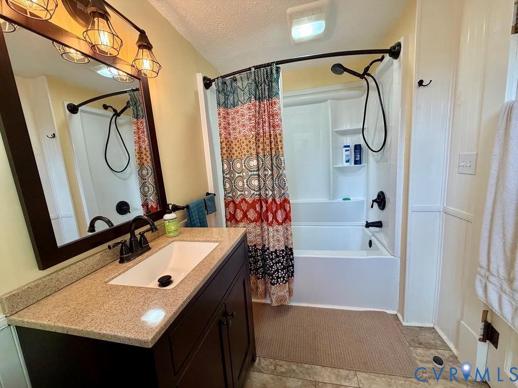 224 Courthouse Road Heathsville, VA 22473 - Photo 25 of 37 a bathroom with a sink vanity tub and a mirror
