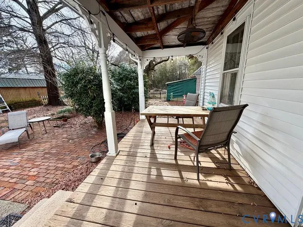 a patio with table and chairs