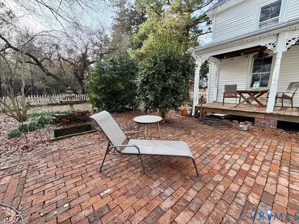 a backyard of a house with outdoor seating