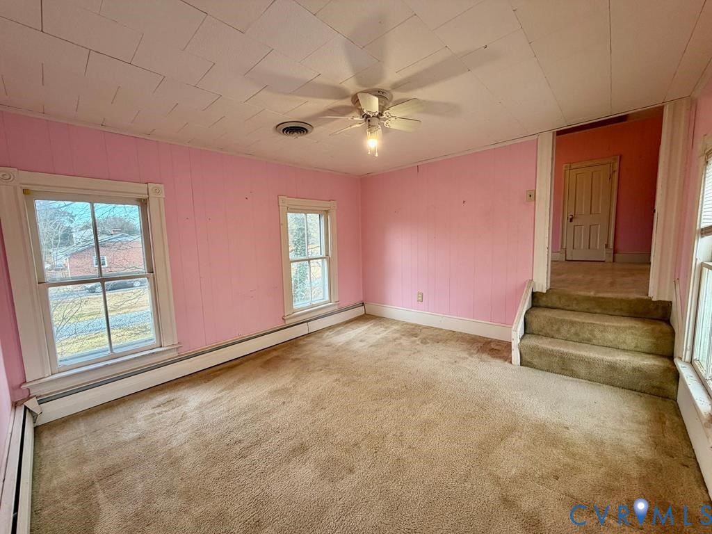 224 Courthouse Road Heathsville, VA 22473 - Photo 32 of 37 an empty room with windows and fan