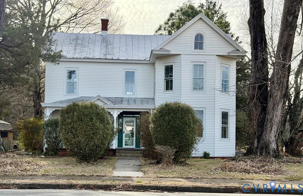 224 Courthouse Road Heathsville, VA 22473 - Photo 4 of 37 a view of a white house with a small yard and large tree