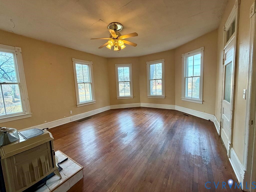 224 Courthouse Road Heathsville, VA 22473 - Photo 10 of 37 a view of an empty room with wooden floor and a window