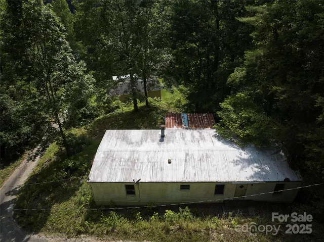 a view of house with a small yard