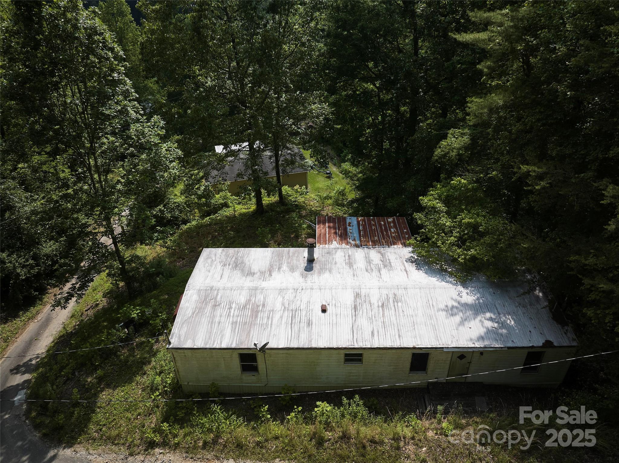 91 Keys Hill Road Almond, NC 28702 - Photo 12 of 19 a view of house with a small yard